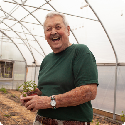 a man holding a plant