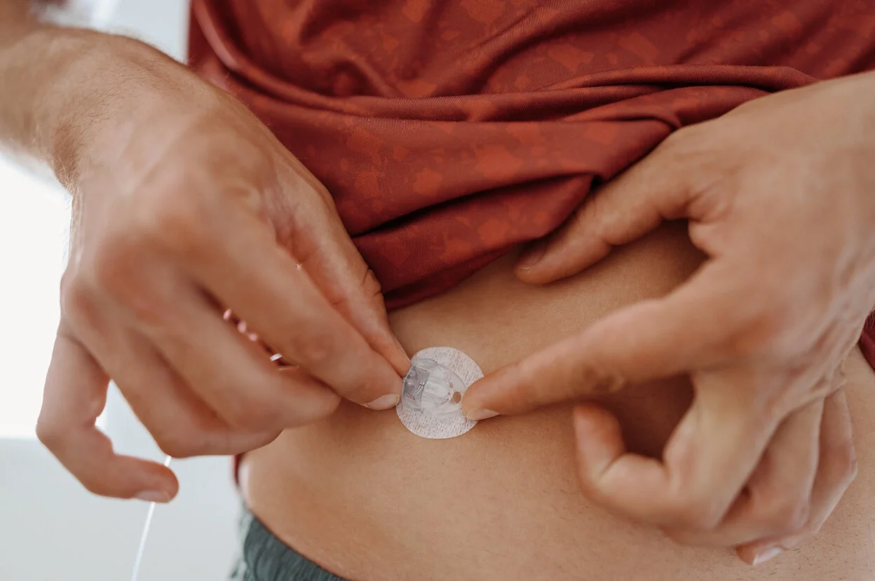 a person holding a small white object