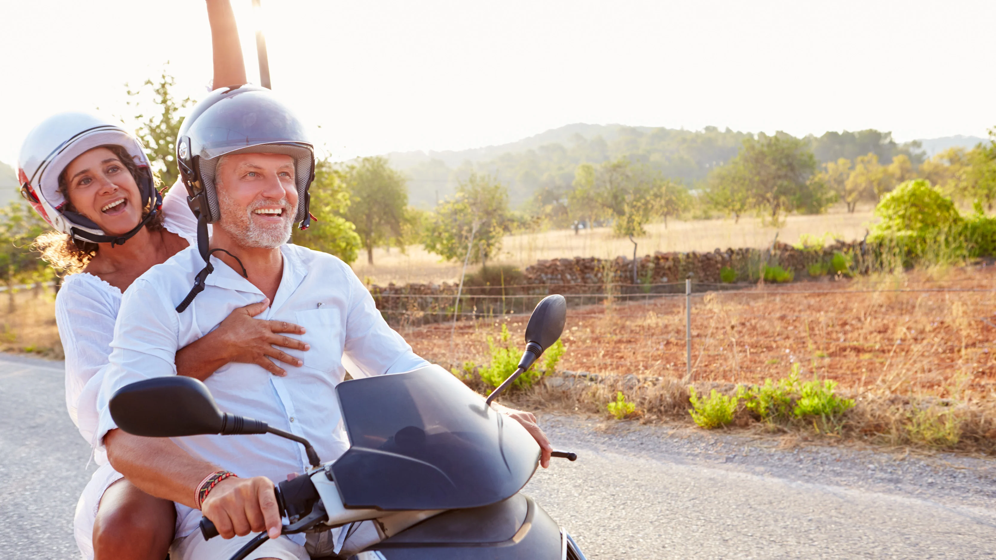 a man and a woman on a motorcycle