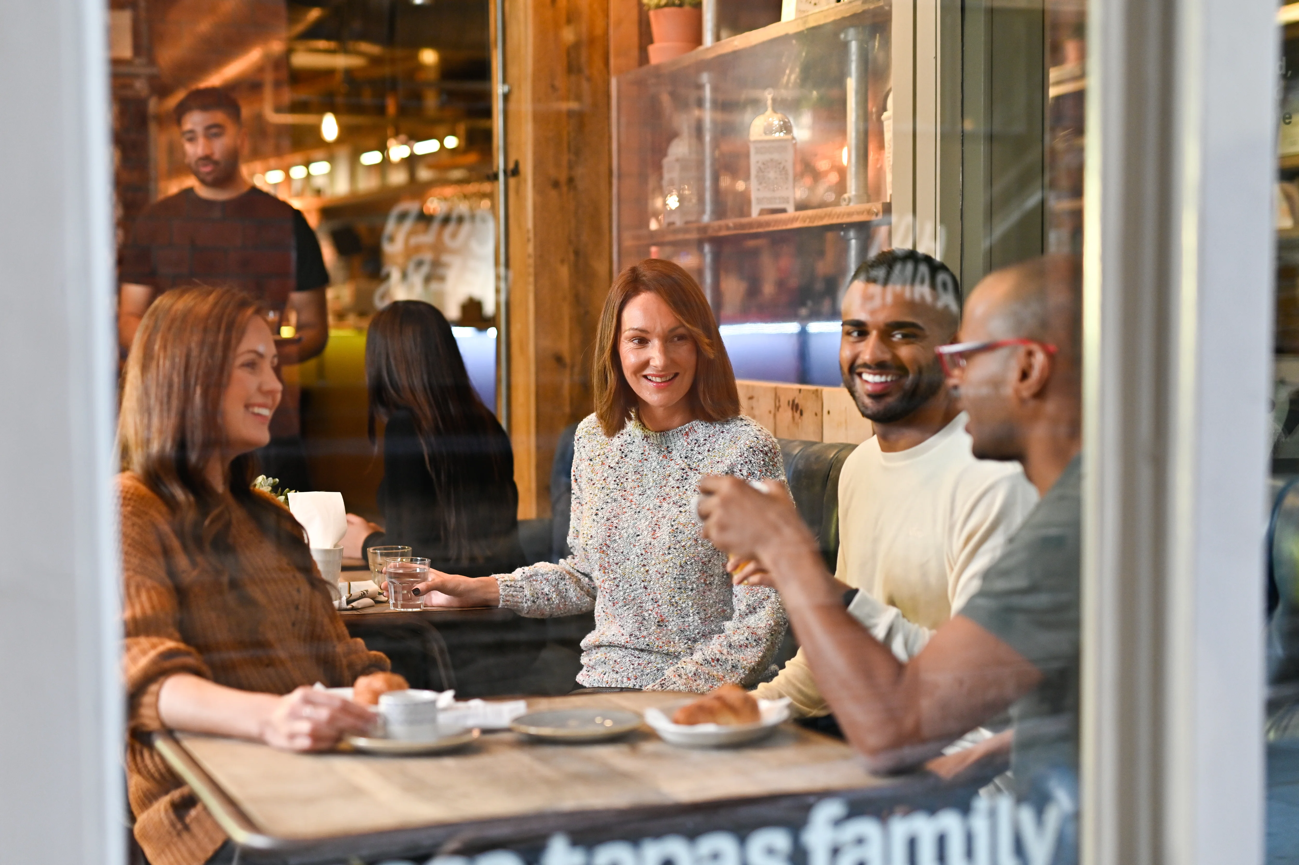 a group of people sitting at a table