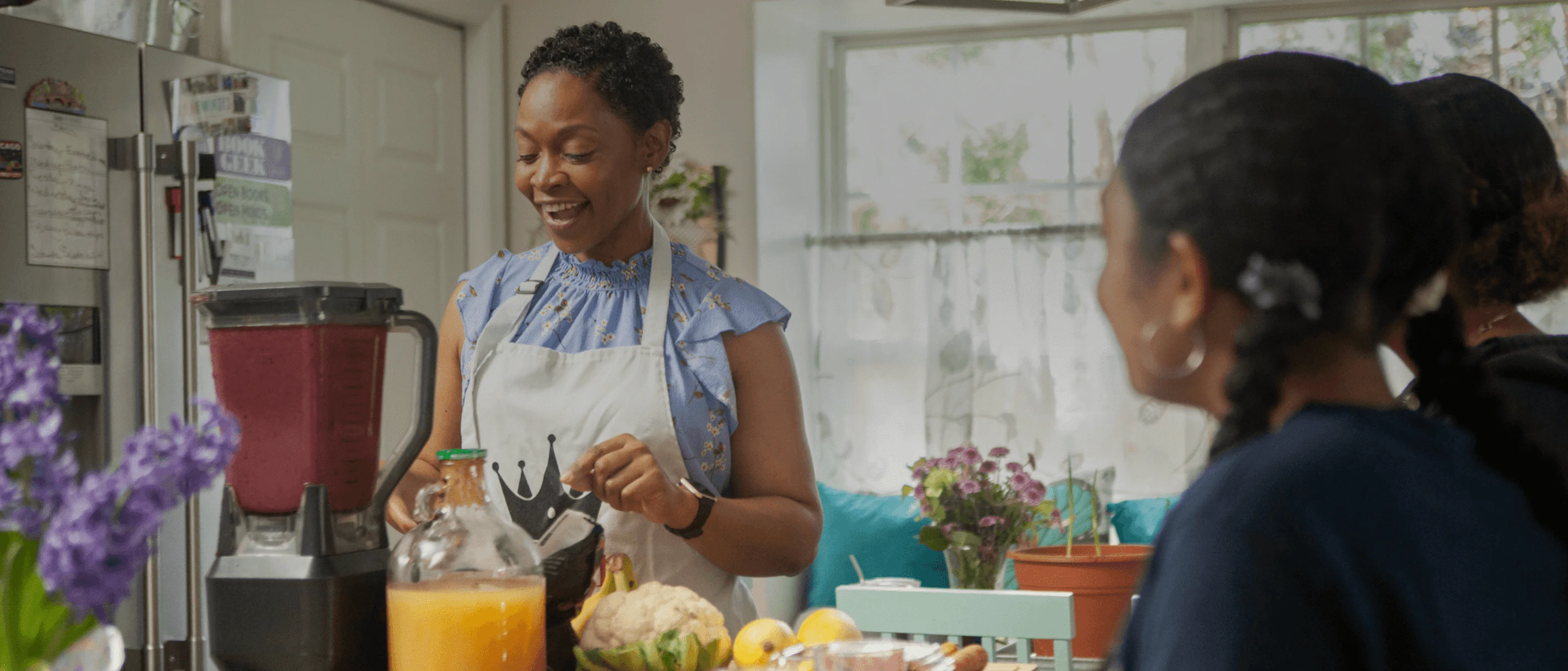 a woman and a girl in a kitchen