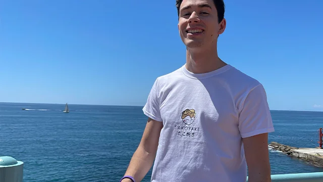 woman in grey dress in her kitchen