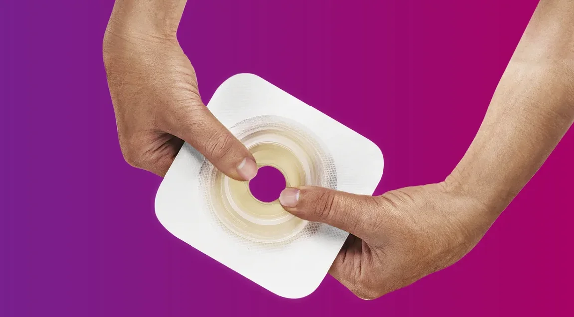 a close-up of a person holding a skin barrier