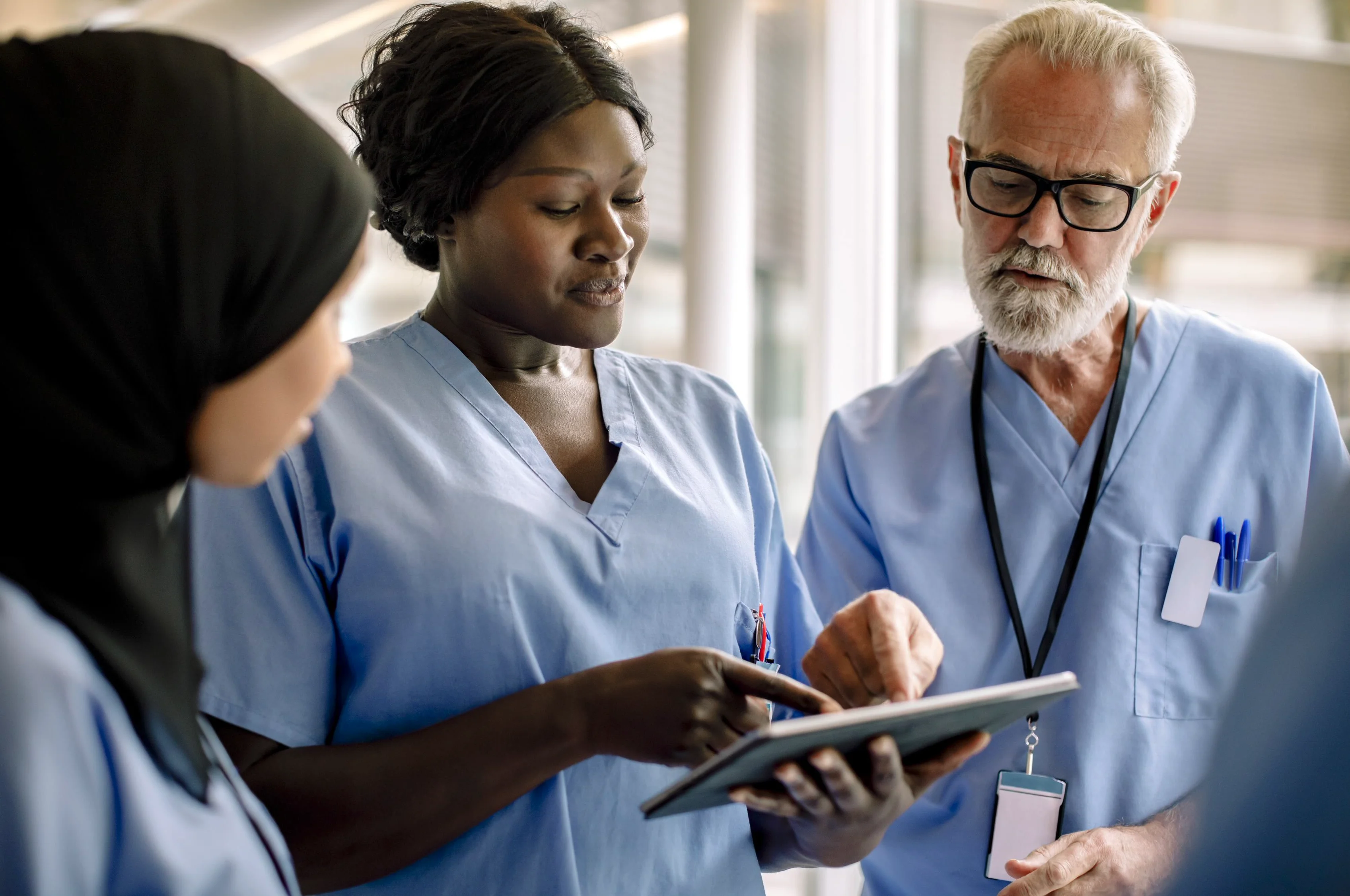 doctors looking at a tablet