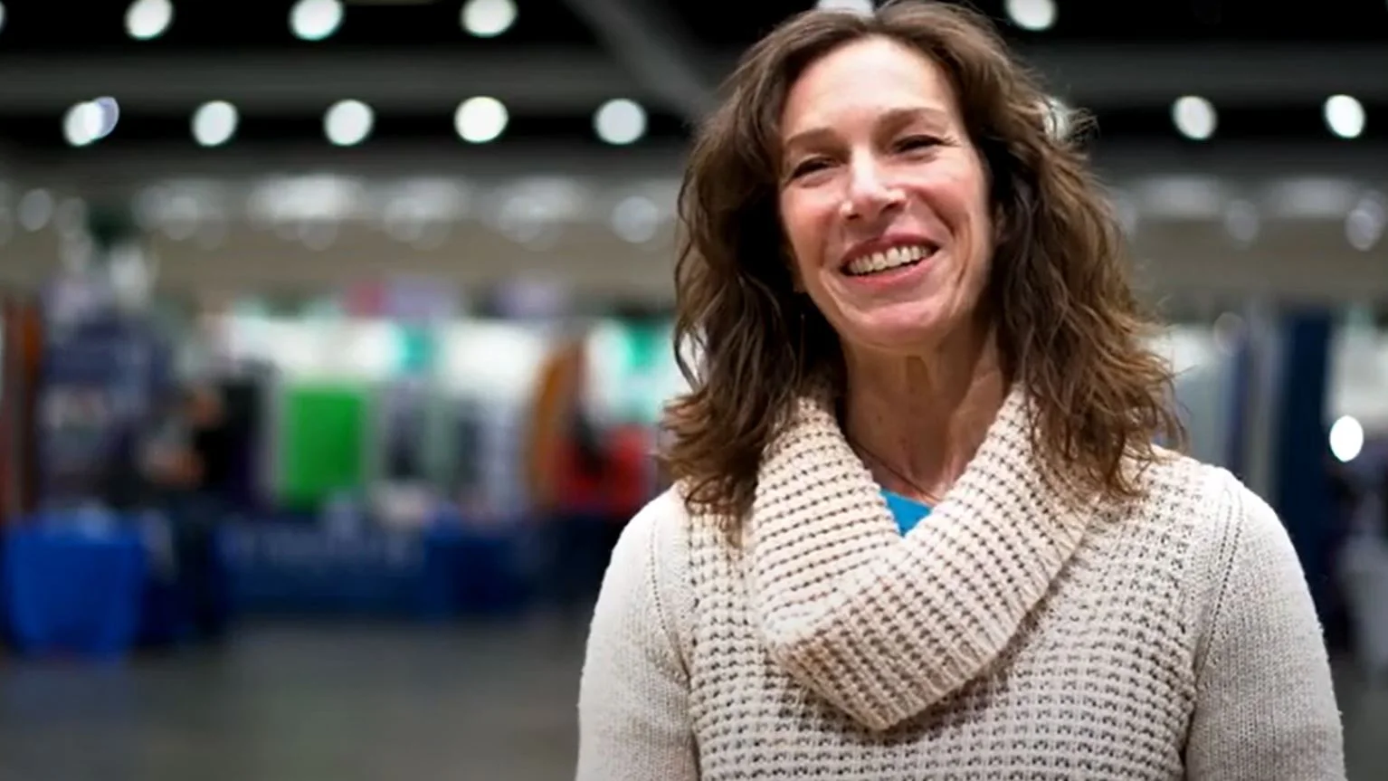 a woman smiling at the camera